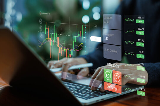 A trader using a laptop with digital candlestick charts and real-time market analytics, symbolizing online trading, financial analysis, investment strategies, and modern fintech technology.