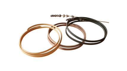 Elegant Bracelets' Trio: A delicate display of three sleek, thin bracelets in contrasting tones, enhanced by a touch of lavender, epitomizing simple elegance.