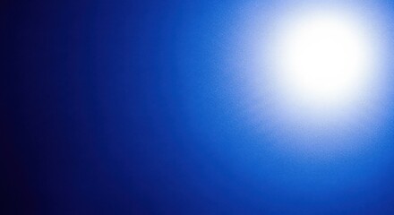 Obraz premium Bright Sunburst Light on Dark Blue Gradient Background