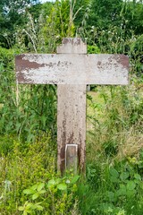 wooden cross on a wild meadow