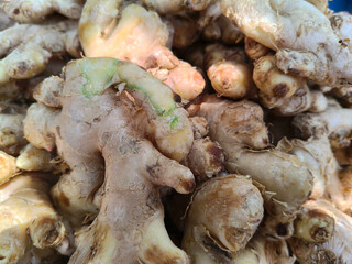 Close up shot of pile of fresh ginger.