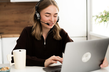 businesswoman wearing headset call center or support service operator helpline, communication support online. Working at home