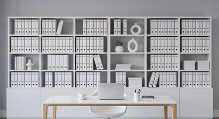 Organized office interior with a wall of white binders on shelves. Modern minimalist workspace with a desk and laptop for data management