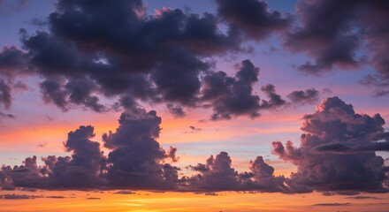 Colorful sunset with dramatic cloud formations, creating a vibrant sky of orange, purple, and blue hues