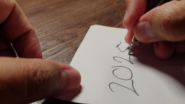 The year &ldquo;2025&rdquo; being crossed out and rewritten as &ldquo;2026,&rdquo; a simple symbolic moment representing new year transition, change, and forward-looking optimism.