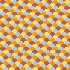 Pattern created from rows of overlapping brown, gold, pale blue and yellow circles