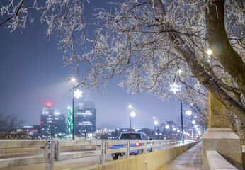 Christmas decorations at Broadway Bridge in Saskatoon, Canada on a foggy and frosty November night.