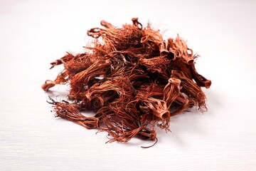 Close up of dried red cotton tree flowers (Kapok flowers) Heap of dried Dok Ngiew , Northern Thai food ingredient.