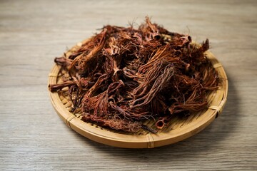 Close up of dried red cotton tree flowers (Kapok flowers) Heap of dried Dok Ngiew , Northern Thai food ingredient.
