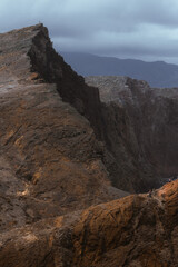 Dramatic volcanic cliffs and serene ocean view at Ponta de S&atilde;o Louren&ccedil;o, Madeira Island, Portugal &ndash; panoramic coastal landscape with sailboats, hiking trails, and wild natural beauty.