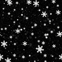 Abstract winter scene featuring delicate snowflakes against a contrasting dark backdrop