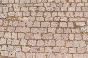 Obraz premium Red brick wall texture with varied sizes and patterns in natural light