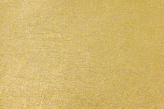上品な光沢を持つ黄金色の和紙の背景素材　Washi Paper Background Texture with Golden Shine Japanese Style Luxury