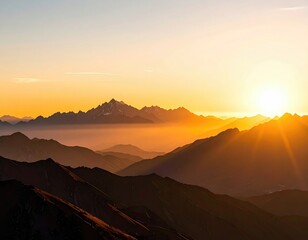 Golden sunrise illuminates layered mountain ranges