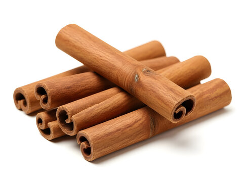 A closeup stack of fragrant cinnamon sticks, a popular spice, isolated on white background for culinary use and baking ingredients