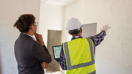 Construction meeting between architect and contractor building site collaborative discussion indoor environment professional viewpoint project planning