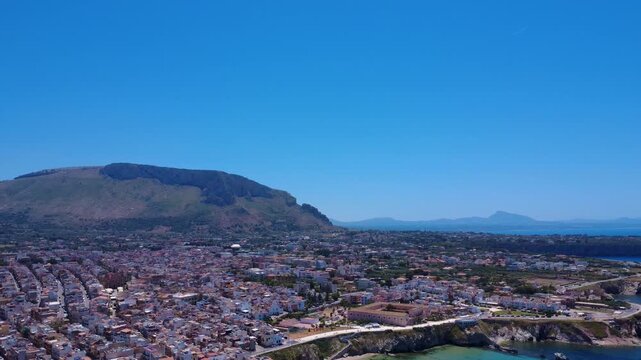 Scenic Aerial View of Coastal City With Mountain Backdrop and Clear Blue Sky During Midday. Terrasini, Sicily, Italy
