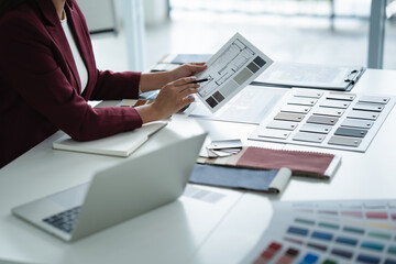 Interior designer selecting wood laminate for modern office