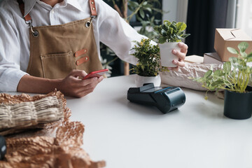 startup SME owner markets small plants for green living and environmental promotion