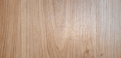 Natural wood texture with a light brown finish, showcasing the beauty of the grain. Ideal for backgrounds in design projects and interior applications, creating a warm atmosphere.