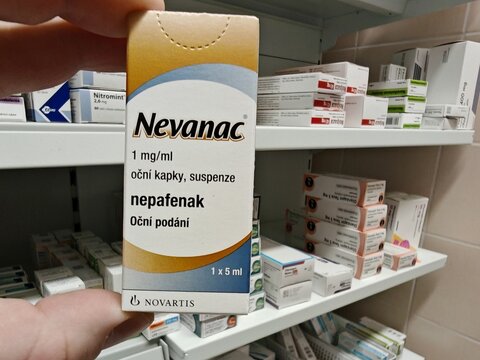 Prague, Czech Republic - November 10 2025: NEVANAC box of medication with nepafenac active substance by Alcon, used for treatment of postoperative pain, inflammation, cataract surgery.Eye drops	
