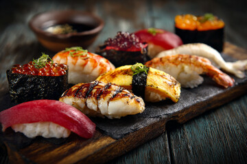 Assortment of delicious sushi rolls and nigiri featuring tuna salmon roe egg and shrimp