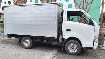box truck parked in a street. delivery service transportation.