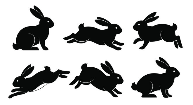 A set of black rabbit silhouettes in various dynamic poses such as sitting running and leaping isolated on a white background.