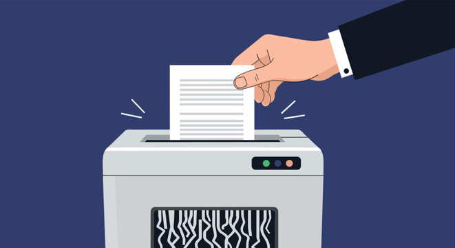 A businessman's hand inserts a confidential document into a paper shredder for data destruction and security on a blue background.