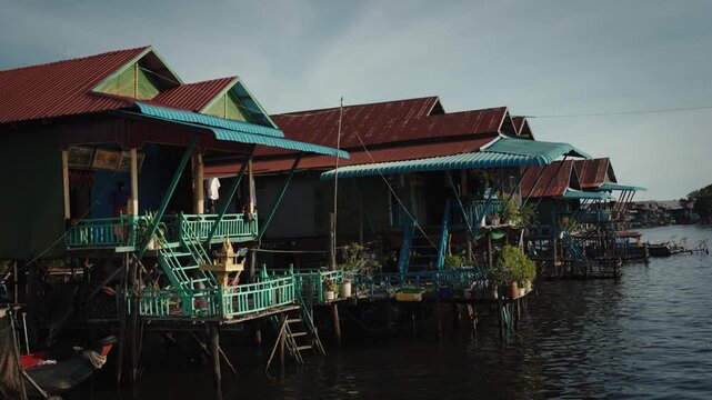 Kampong Phluk floating village with stilt houses on Tonle Sap lake in Cambodia.