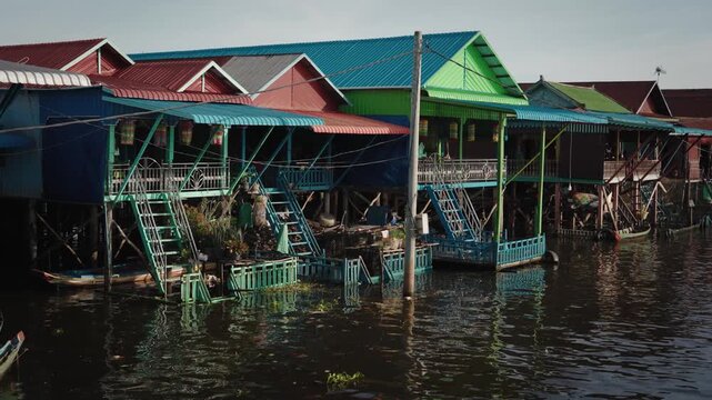 Kampong Phluk floating village with stilt houses on Tonle Sap lake in Cambodia.