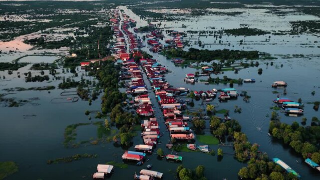 Kampong Phluk floating village with stilt houses on Tonle Sap lake in Cambodia.