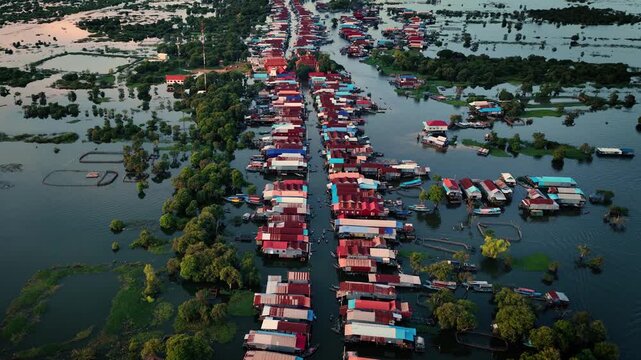 Kampong Phluk floating village with stilt houses on Tonle Sap lake in Cambodia.