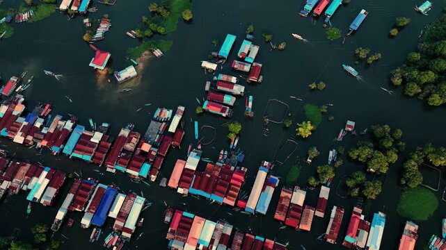 Kampong Phluk floating village with stilt houses on Tonle Sap lake in Cambodia.
