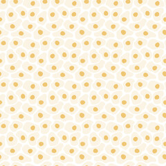 Abstract yolk splash seamless pattern with fried egg shapes for modern culinary visuals