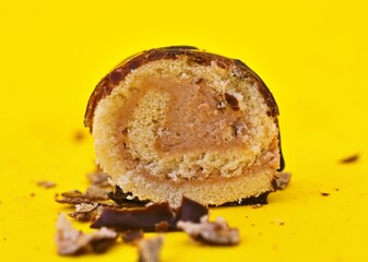 Mini Chocolate Cake Roll Swiss Roll on yellow background