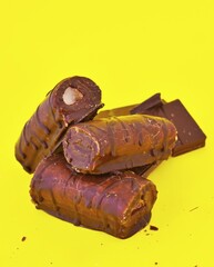 Mini Chocolate Cake Roll Swiss Roll on yellow background