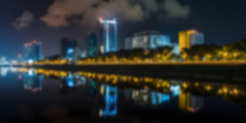 Fototapeta premium Nighttime Cityscape with Reflections and Illuminated Skyscrapers Blur photo Concept