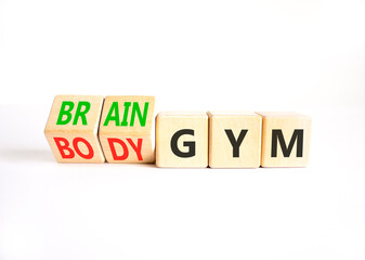 Body vs brain gym symbol. Concept words Body gym to Brain gym on beautiful wooden cubes. Beautiful white table white background. Business healthy lifestyle and body vs brain gym concept. Copy space.
