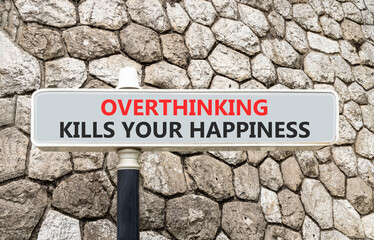 Overthinking kills your happiness symbol. Concept words Overthinking kills your happiness on grey road sign. Beautiful stone wall background. Business overthinking kills happiness concept. Copy space.