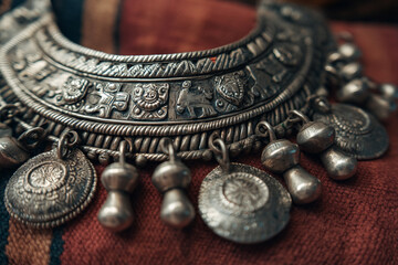 A close-up of Somali handmade silver jewelry, intricately designed with cultural motifs, emphasizing local craftsmanship and adornment.