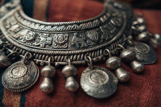 A close-up of Somali handmade silver jewelry, intricately designed with cultural motifs, emphasizing local craftsmanship and adornment.