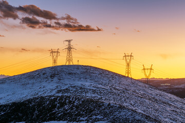 The Power Grid on the Snowy Plateau at dusk