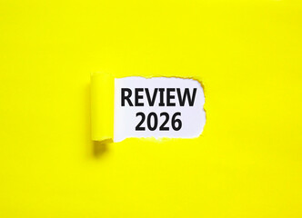 Review 2026 symbol. Concept words Review 2026 on beautiful white paper. Beautiful yellow paper background. Business and review 2026 concept. Copy space.