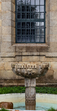 Antique granite stone fountain in San Salvador de Lourenz&aacute; Monastery.
