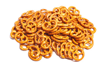 Many delicious pretzels isolated on white