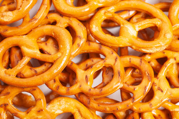 Many delicious pretzels as background