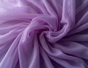 Sheer purple fabric texture drapes in soft folds. Light catches the translucent material creating subtle shimmer. Gentle waves form abstract pattern on soft textile backdrop.