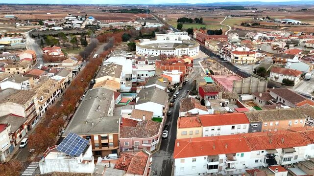 Aerial low altitude view of Tarazona rooftops bullring and rural landscape