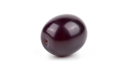 A single dark purple grape isolated on white background